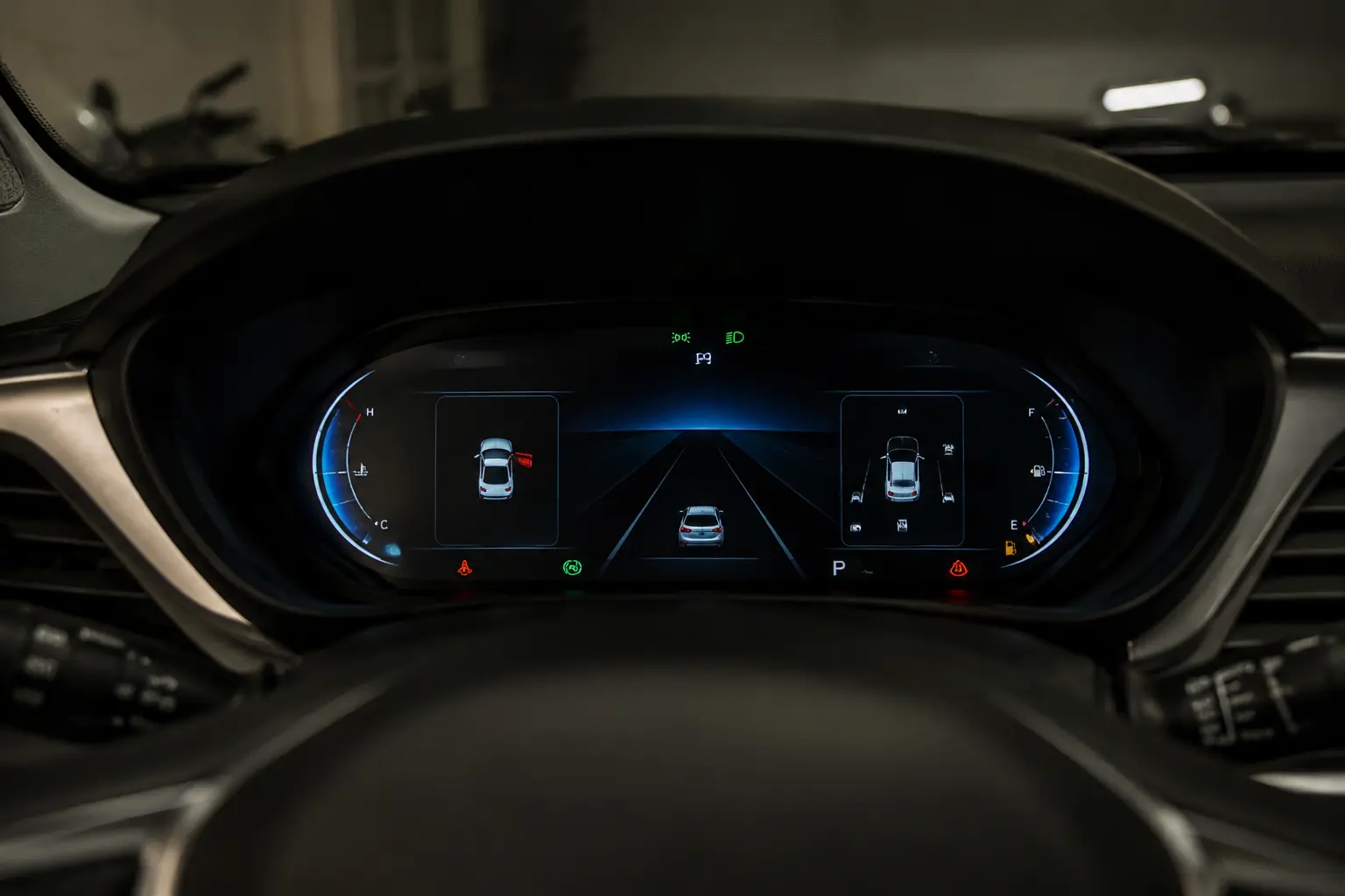 Infotainment vs. Instrument Cluster: What’s the Difference? Digital instrument cluster behind a car steering wheel
